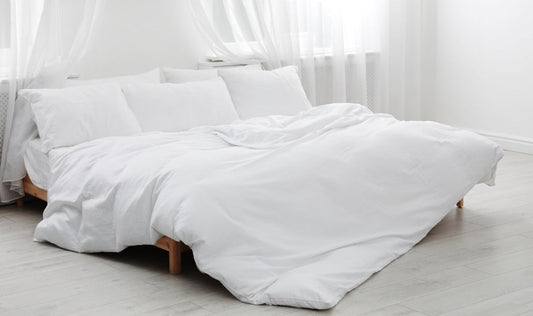 beautiful goose down bedding on a bed