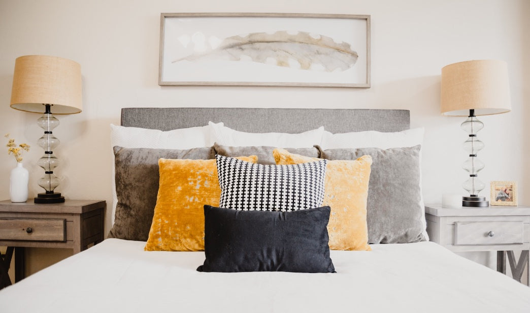 stylish decorative pillows on bed
