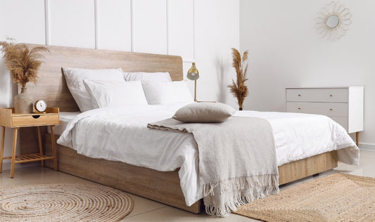 stylish bedroom with goose down bedding and a blanket