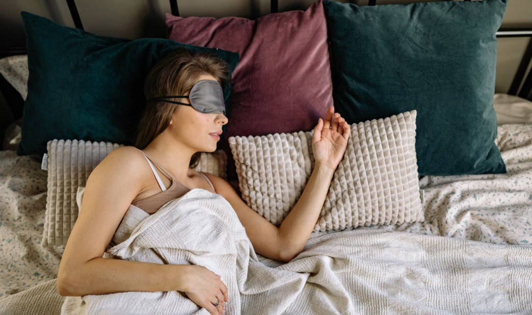 woman sleeping deeply with a blindfold