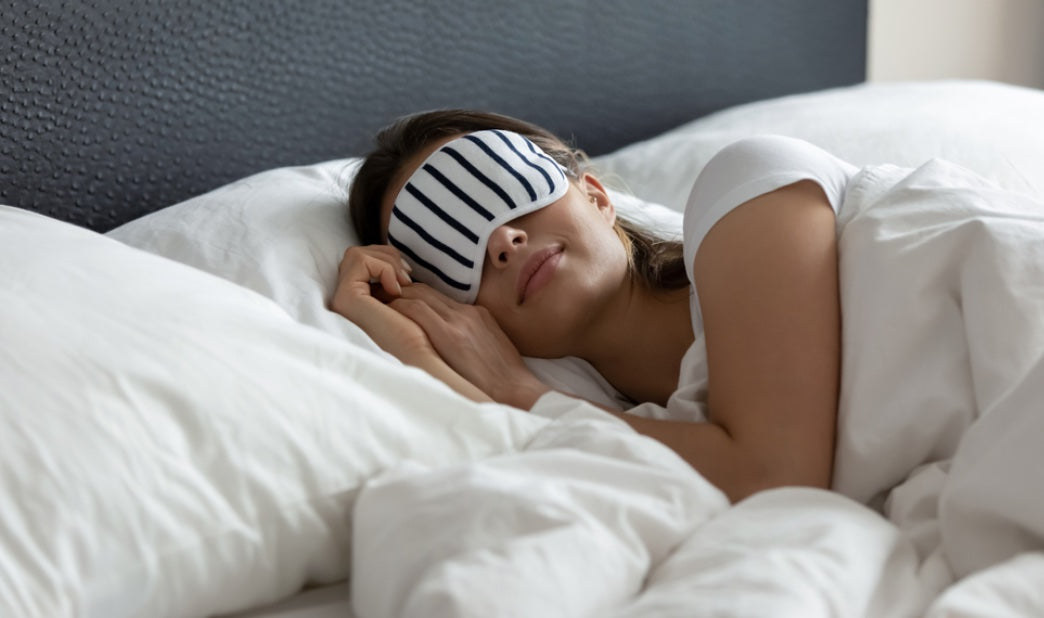 woman-sleeping-with-stripy-eye-mask