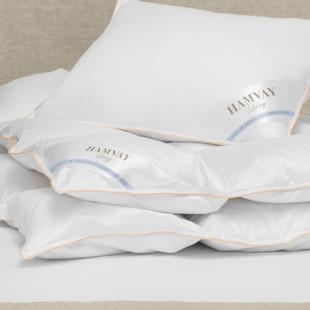 toddler down comforter and pillow on bed