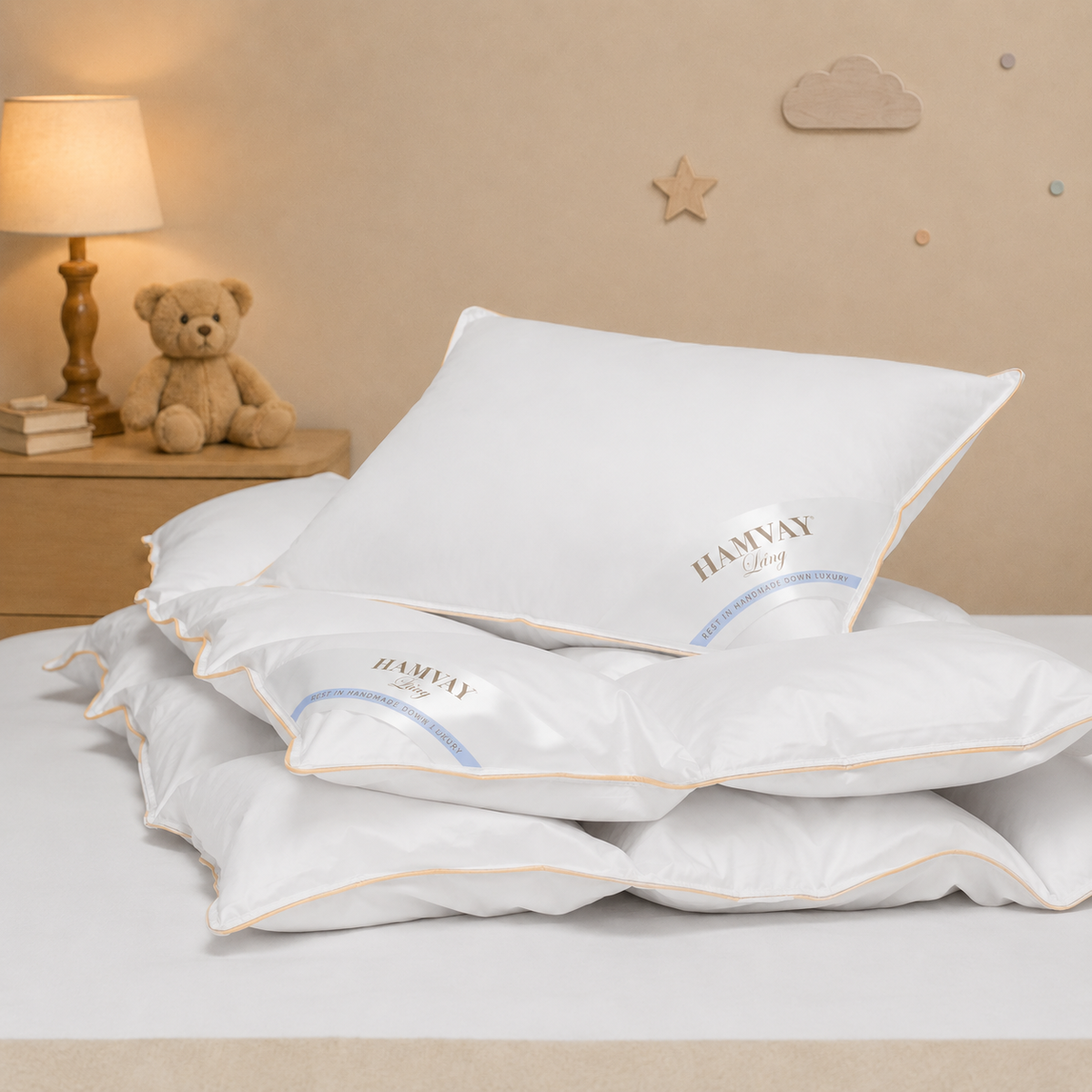 White Hamvay-Láng plush pillow on a bed in a softly lit bedroom setting with a lamp, teddy bear, and wall decorations.
