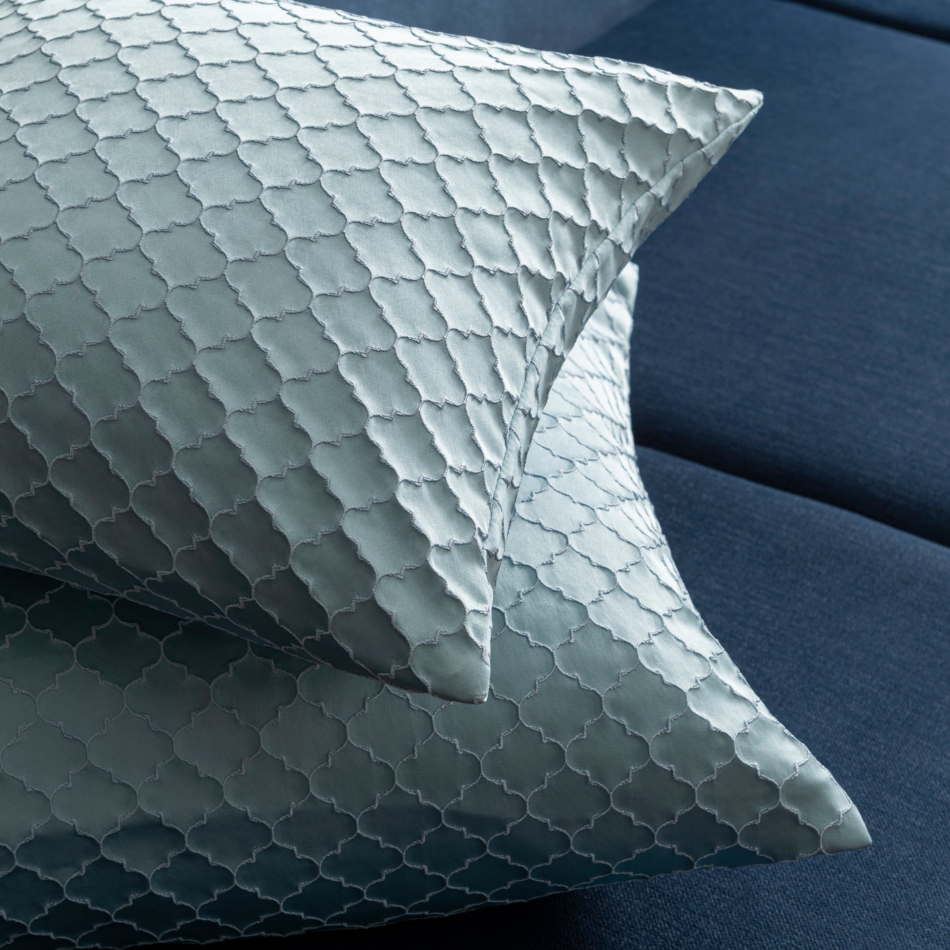 blue decorative pillows placed on each other