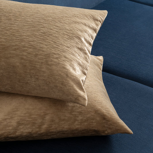 golden decorative pillows placed on each other